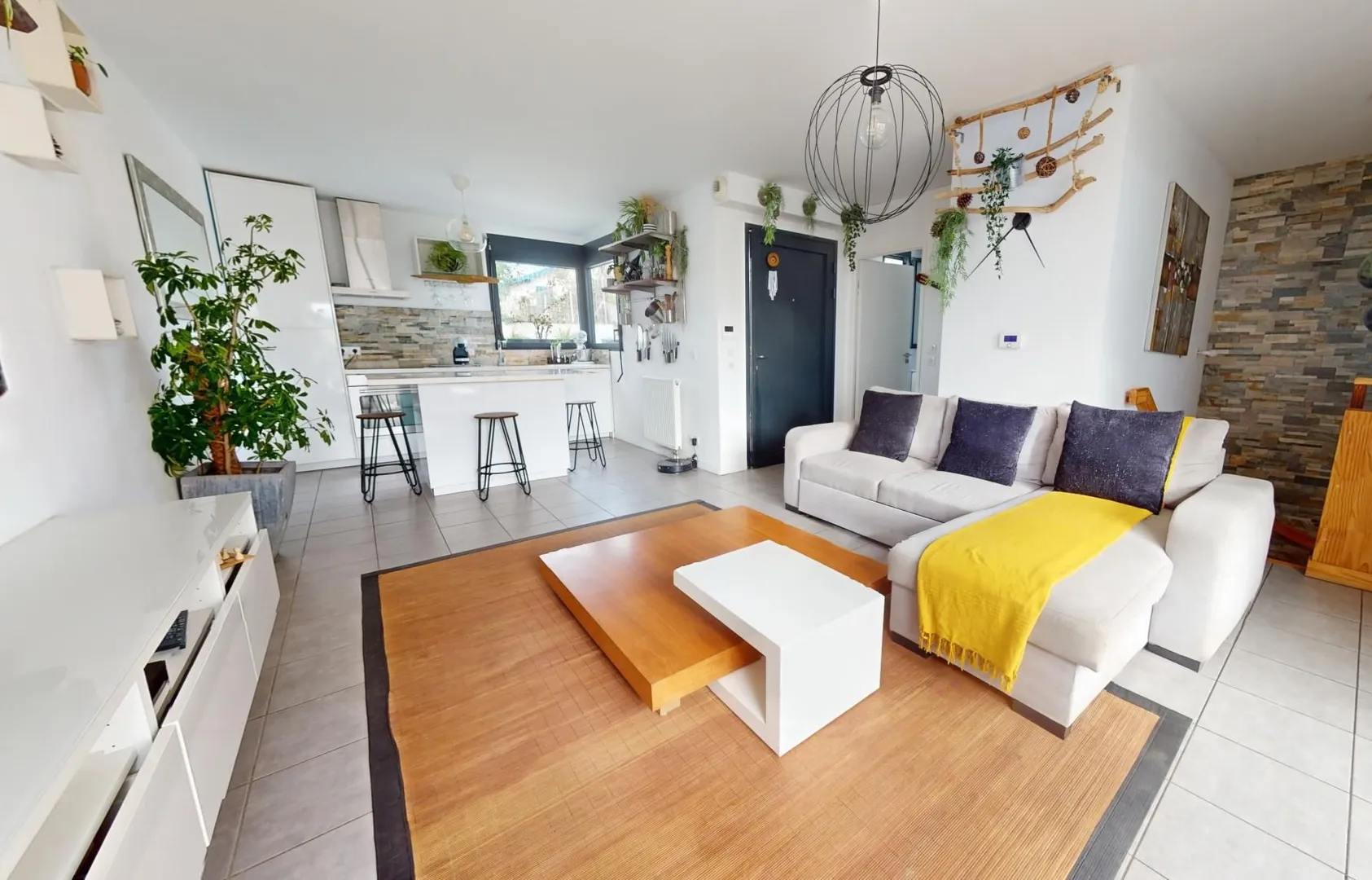 Modern living room with beige sofa and circular wall art