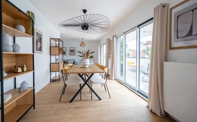 Modern living room with beige sofa and circular wall art