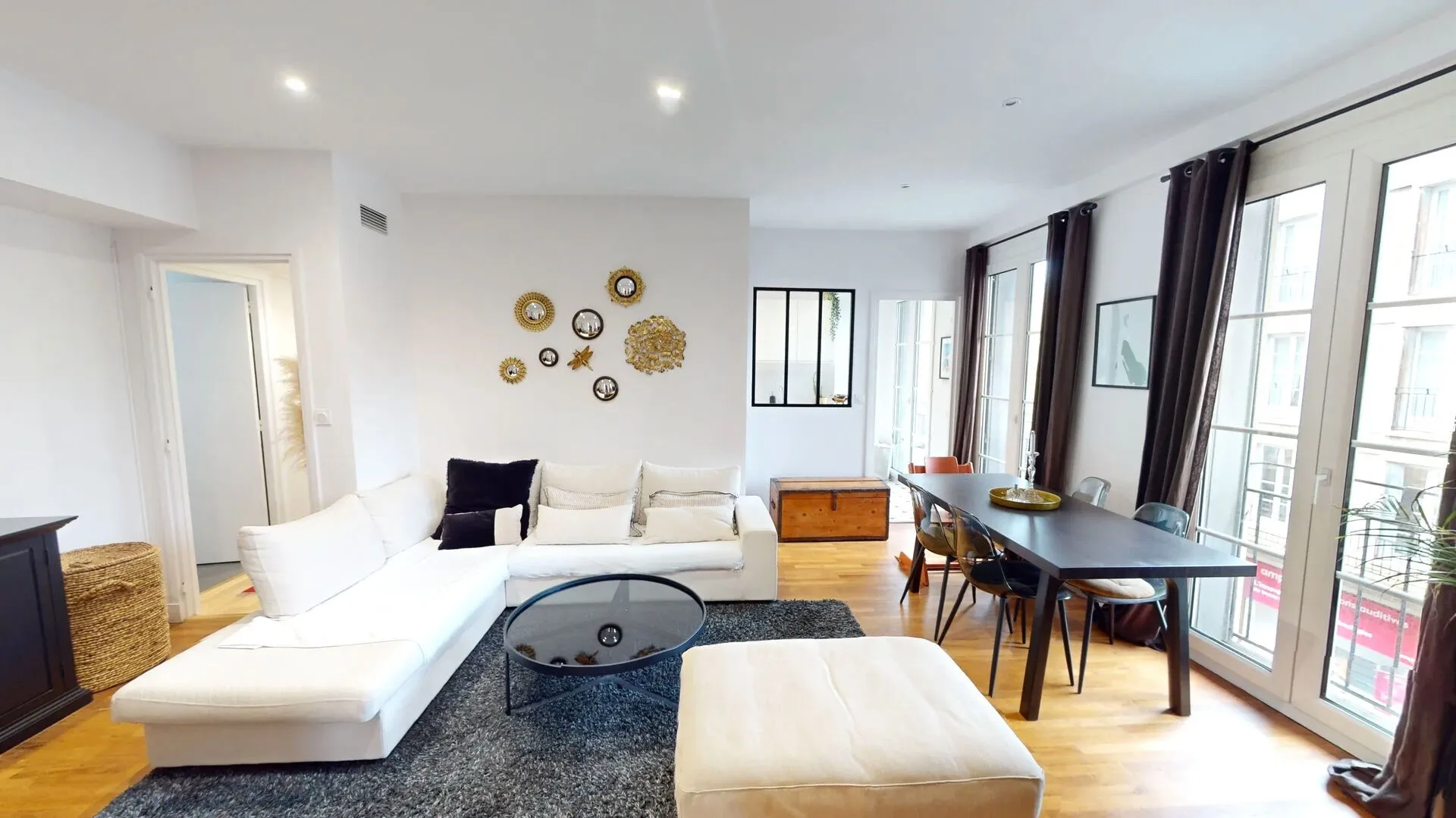 Modern living room with beige sofa and circular wall art