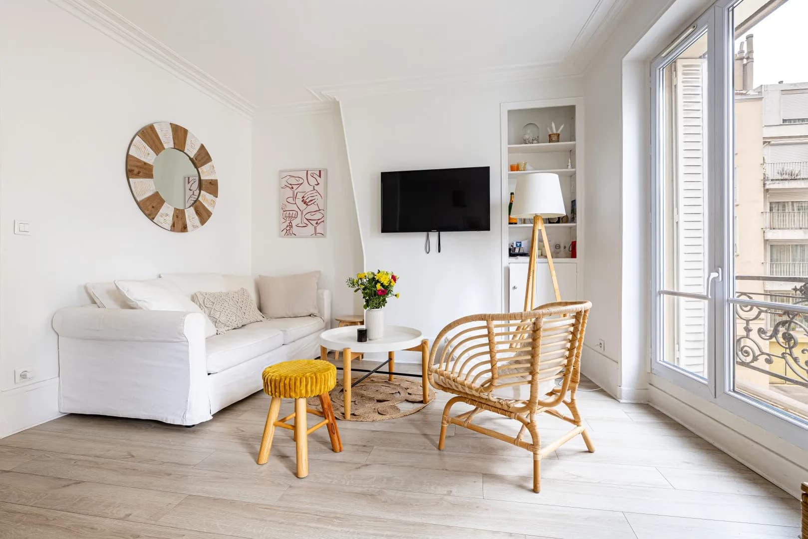 Modern living room with beige sofa and circular wall art