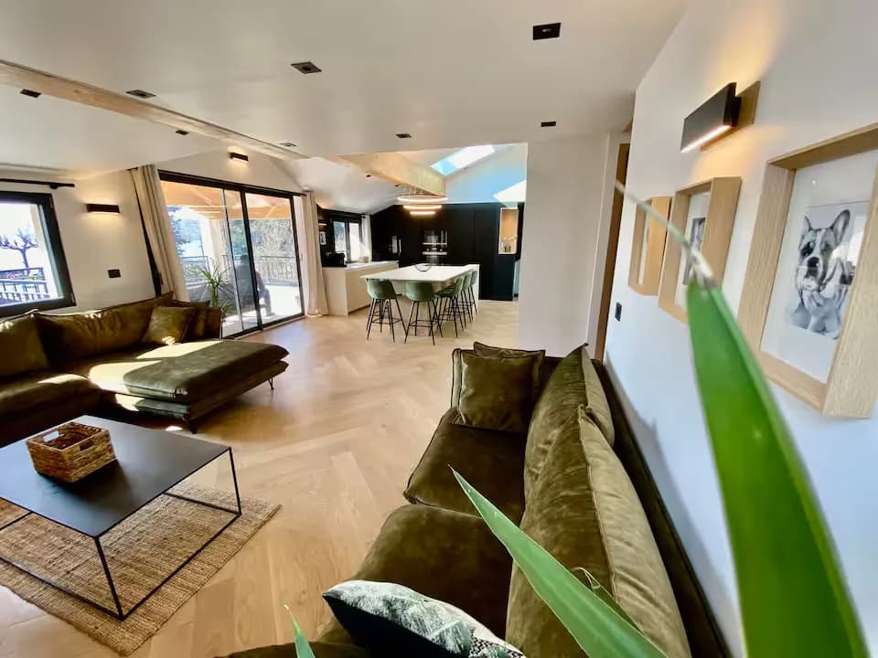 Modern living room with beige sofa and circular wall art