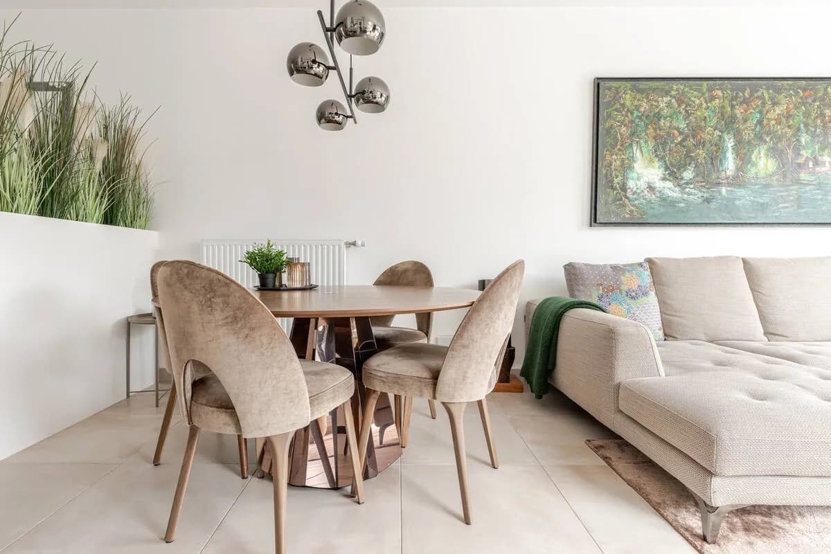 Modern living room with beige sofa and circular wall art