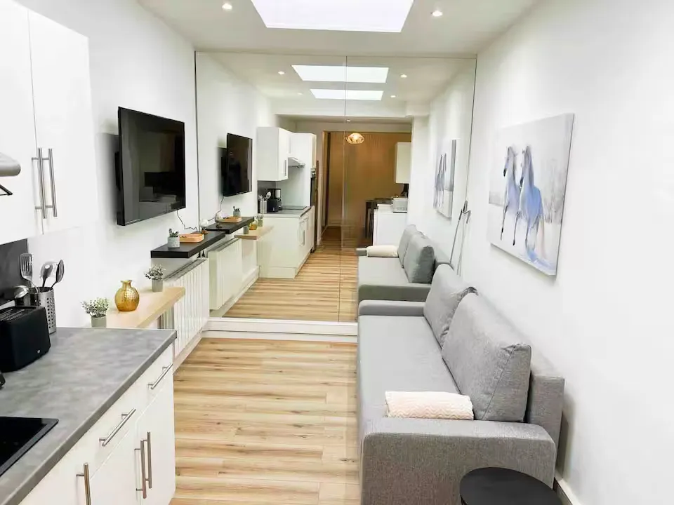 Modern living room with beige sofa and circular wall art