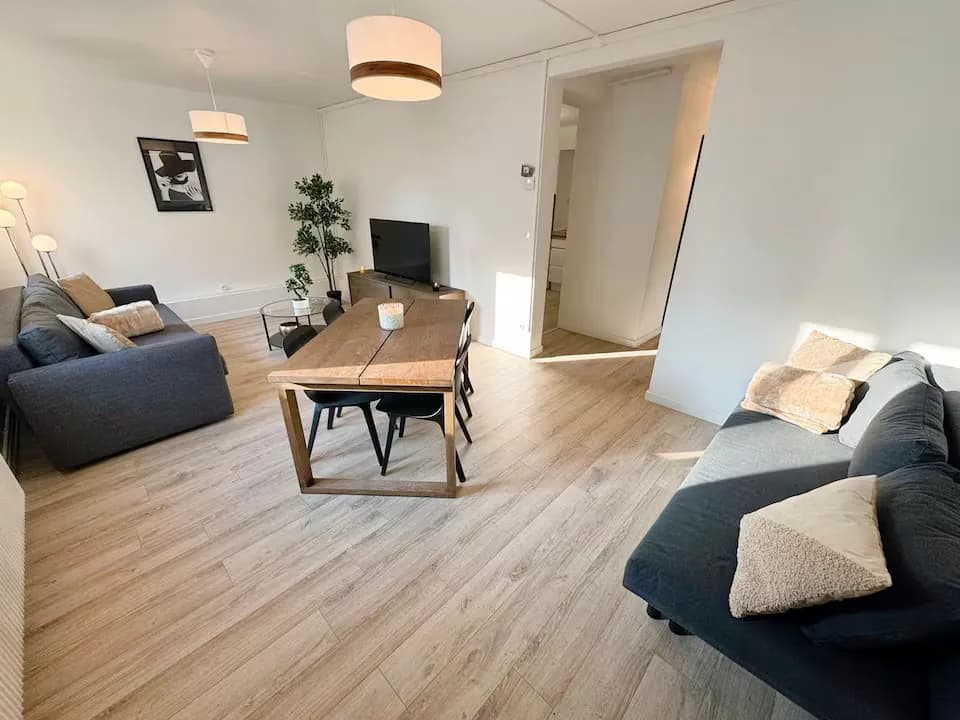 Modern living room with beige sofa and circular wall art