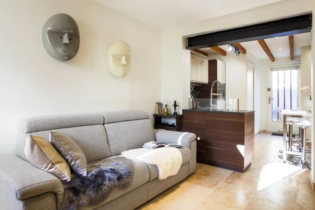 Modern living room with beige sofa and circular wall art