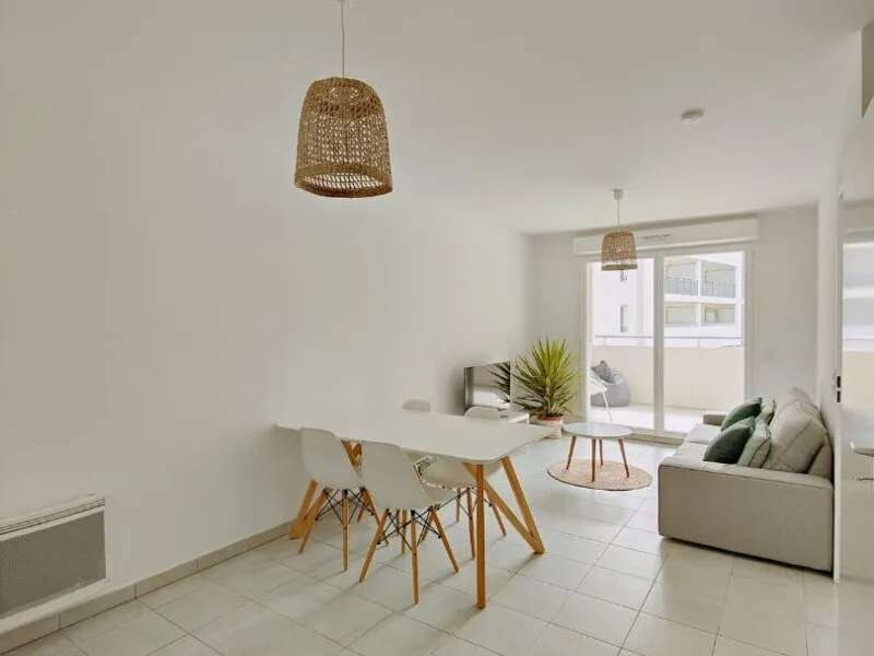 Modern living room with beige sofa and circular wall art