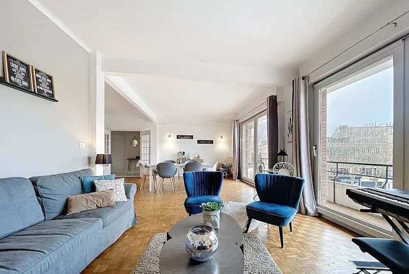 Modern living room with beige sofa and circular wall art