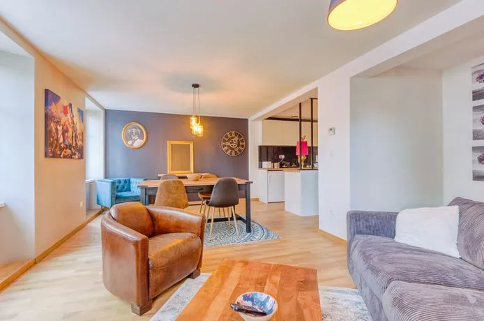 Modern living room with beige sofa and circular wall art