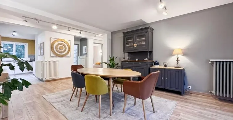 Modern living room with beige sofa and circular wall art