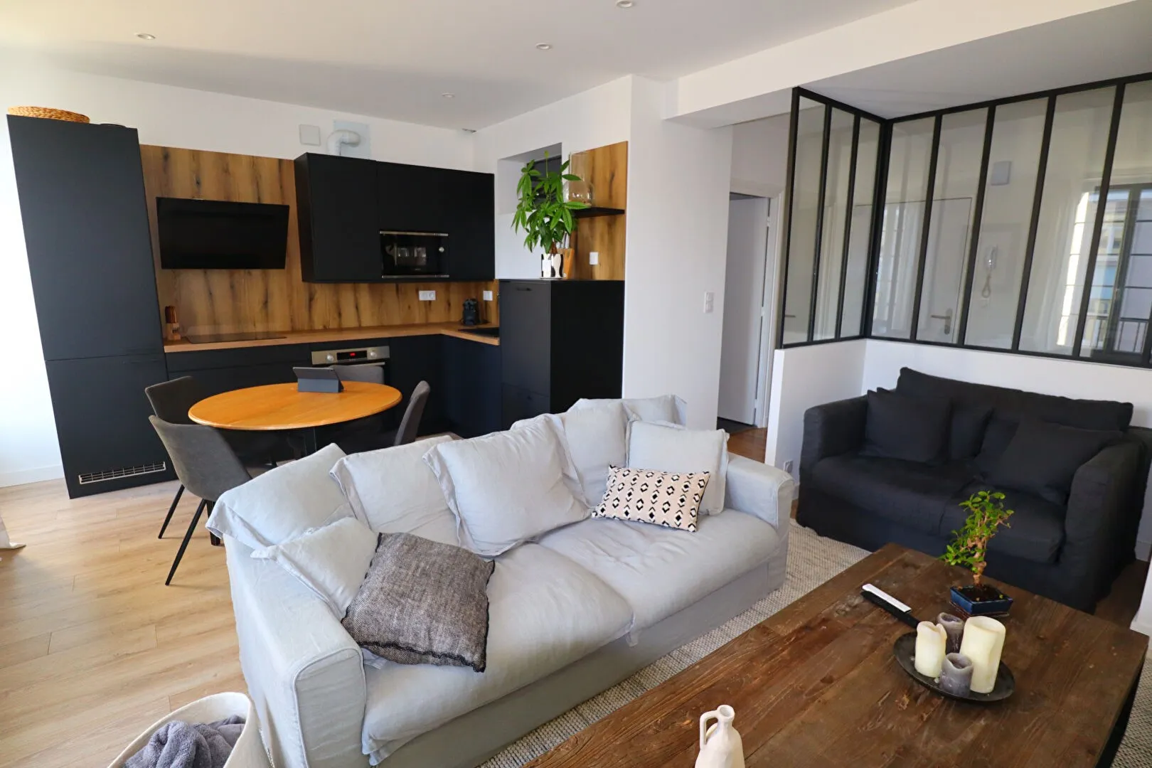 Modern living room with beige sofa and circular wall art