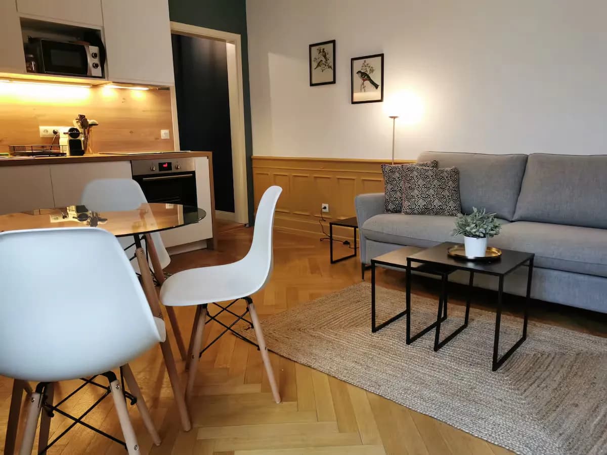 Modern living room with beige sofa and circular wall art